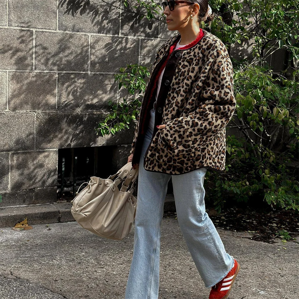 A women's patterned jacket with a bold statement design, styled with a chic outfit, perfect for adding a touch of confidence and unique flair to casual or semi-formal looks.