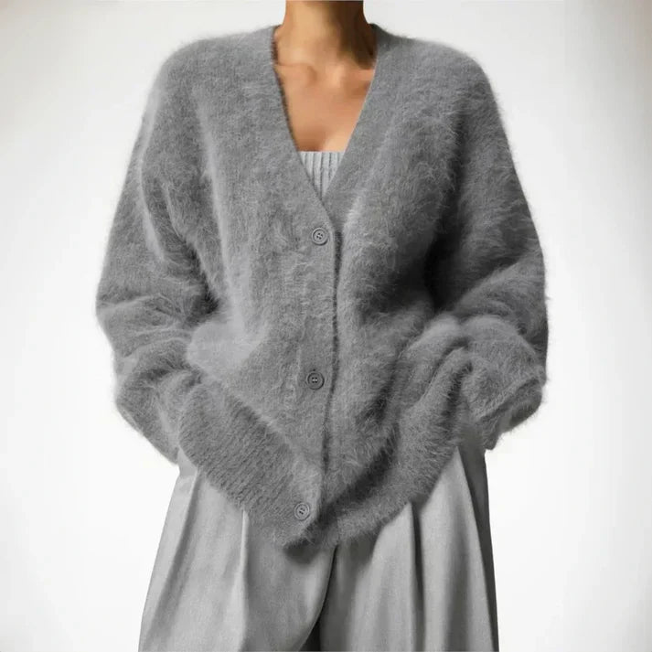 Women's soft knit cardigan with button-down front, featuring a cozy and elegant design, perfect for layering or standalone wear.