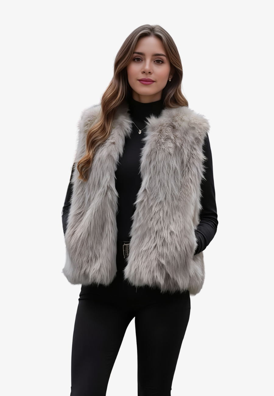 A stylish woman wearing a fluffy vest paired with a turtleneck top and a skirt, showcasing the elegant design and cozy texture of the Ava Women's Fluffy Vest, ideal for layering in chic outfits.