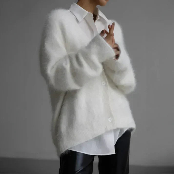 Women's soft knit cardigan with button-down front, featuring a cozy and elegant design, perfect for layering or standalone wear.