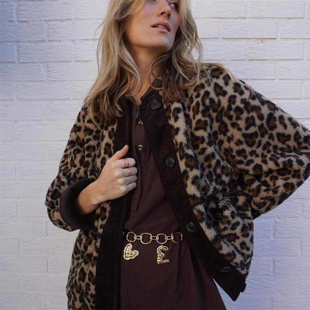 A women's patterned jacket with a bold statement design, styled with a chic outfit, perfect for adding a touch of confidence and unique flair to casual or semi-formal looks.