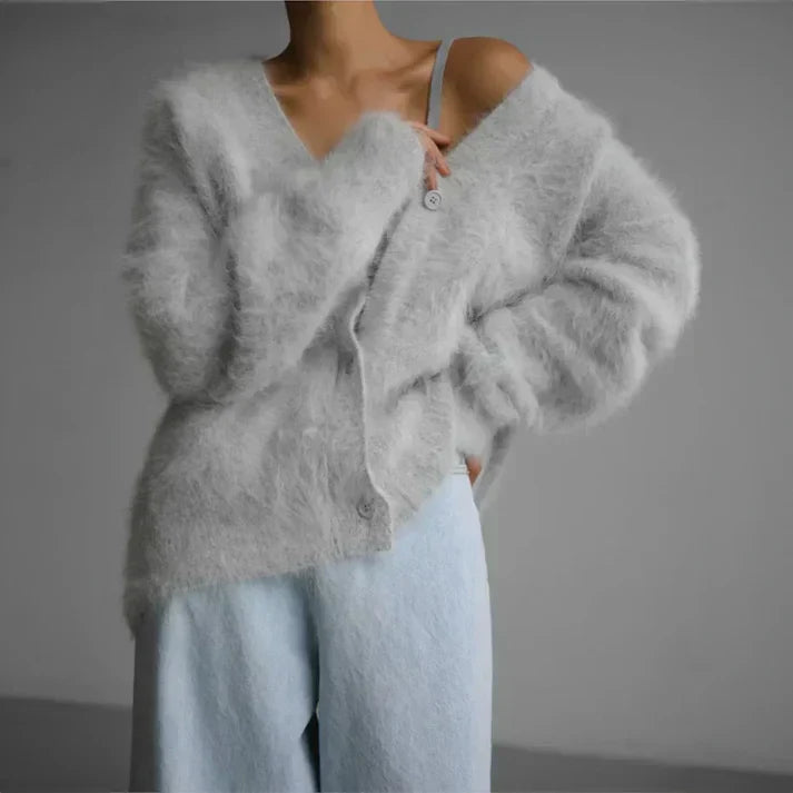 Women's soft knit cardigan with button-down front, featuring a cozy and elegant design, perfect for layering or standalone wear.