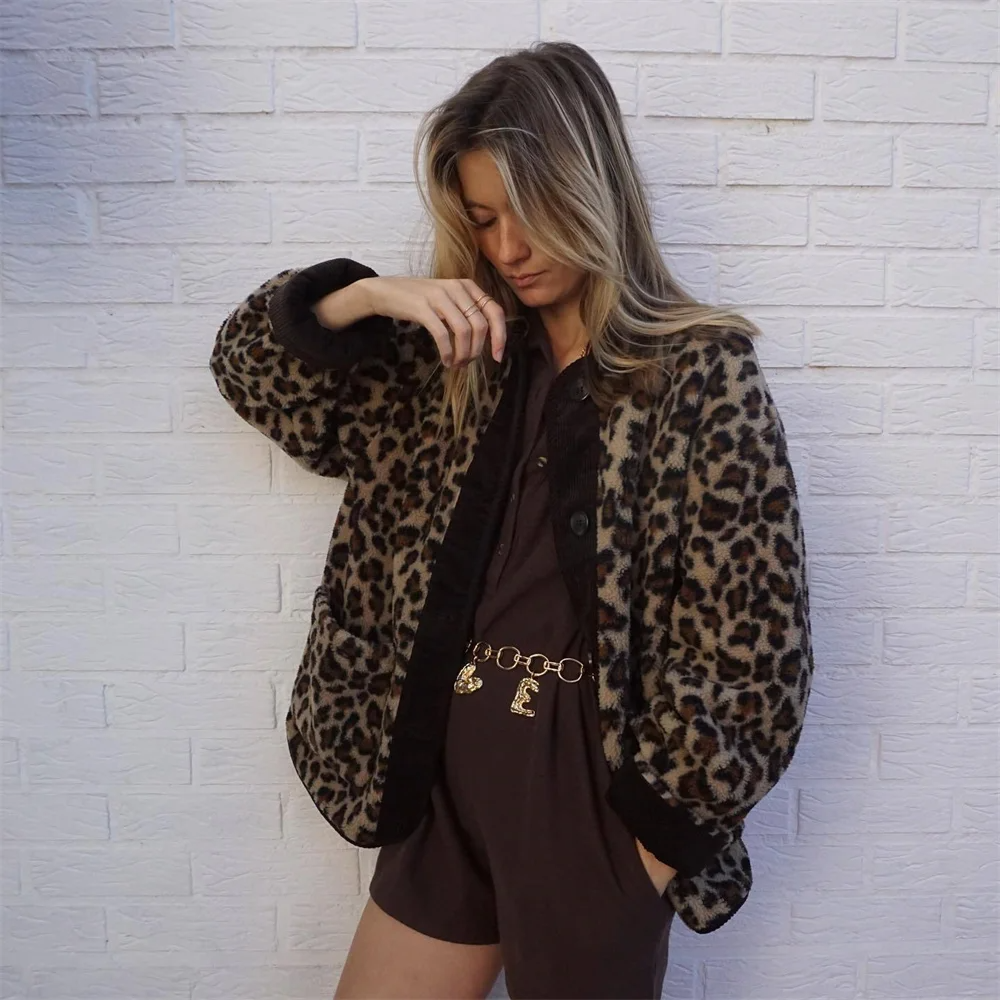 A women's patterned jacket with a bold statement design, styled with a chic outfit, perfect for adding a touch of confidence and unique flair to casual or semi-formal looks.