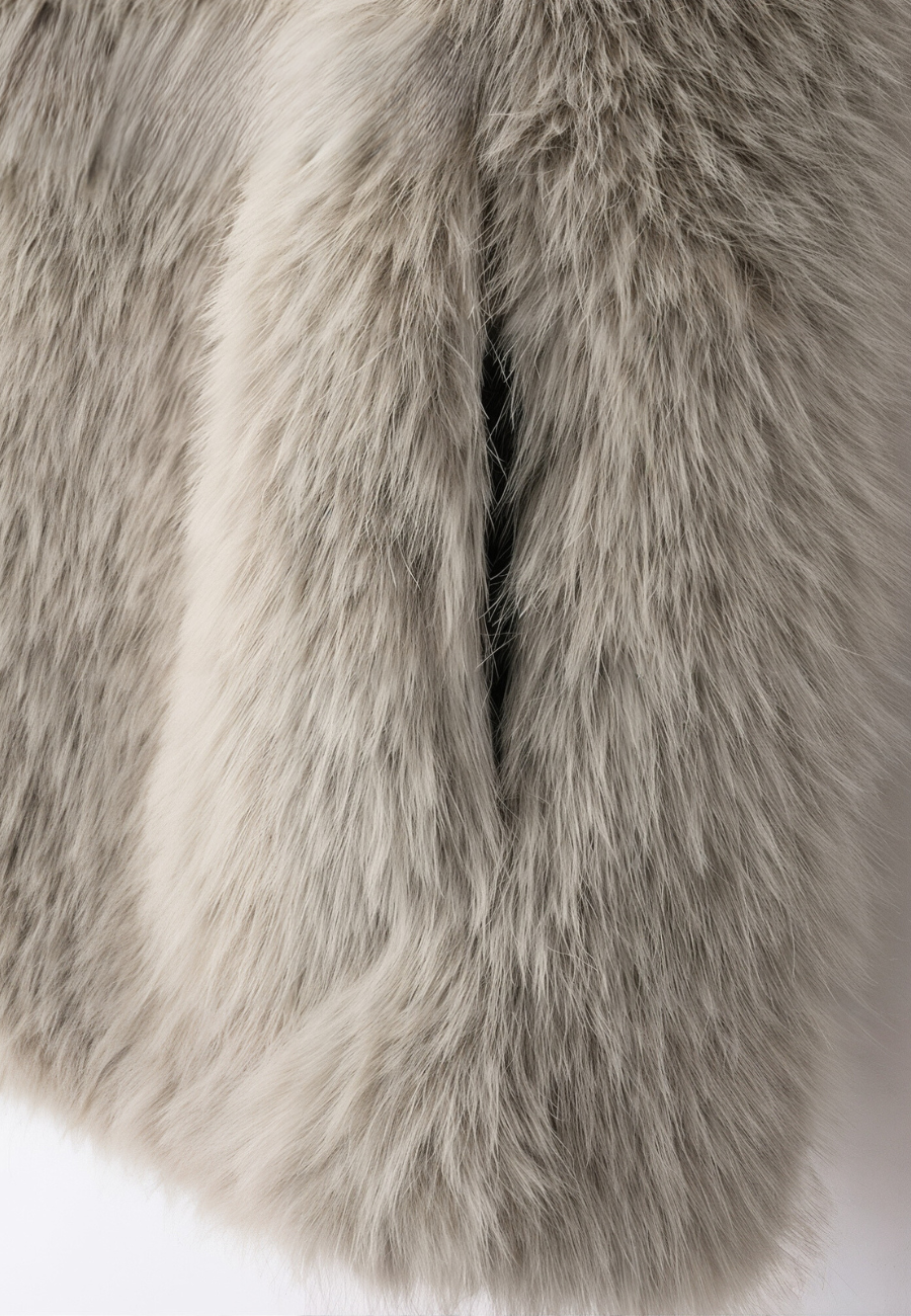 A stylish woman wearing a fluffy vest paired with a turtleneck top and a skirt, showcasing the elegant design and cozy texture of the Ava Women's Fluffy Vest, ideal for layering in chic outfits.