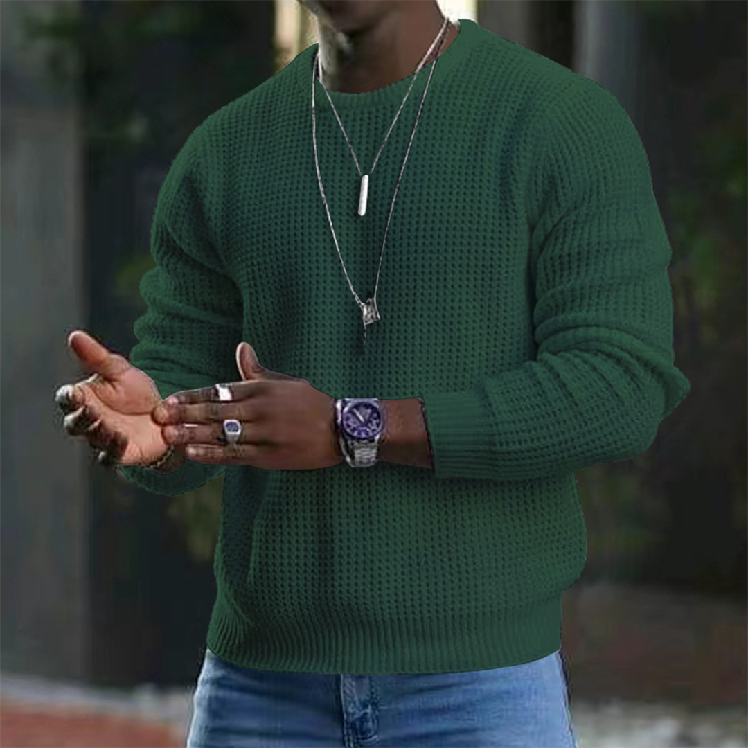 A stylish men's textured sweater featuring a modern design, paired with casual jeans and accessories. Perfect for a sleek and comfortable look suitable for both casual outings and smart occasions.