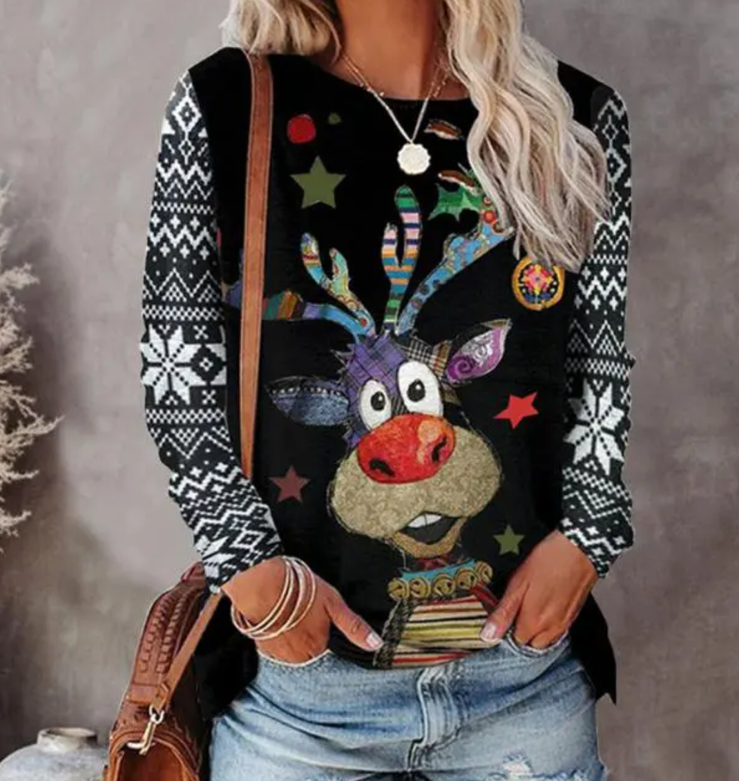 A festive women's sweater featuring a cheerful reindeer design with snowflake accents, styled casually with jeans and accessories, perfect for holiday gatherings and winter celebrations.