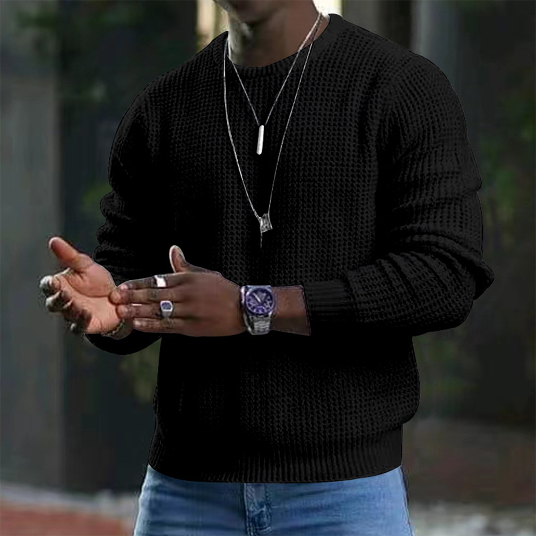 A stylish men's textured sweater featuring a modern design, paired with casual jeans and accessories. Perfect for a sleek and comfortable look suitable for both casual outings and smart occasions.