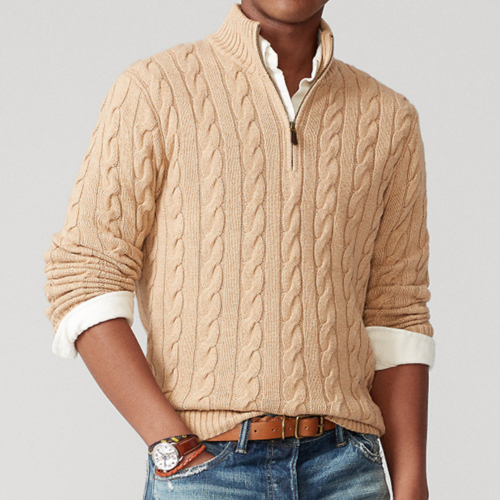 A men's cable knit sweater featuring a classic design with a zip-up collar, tailored for warmth and style, perfect for casual wear or layering in colder weather.