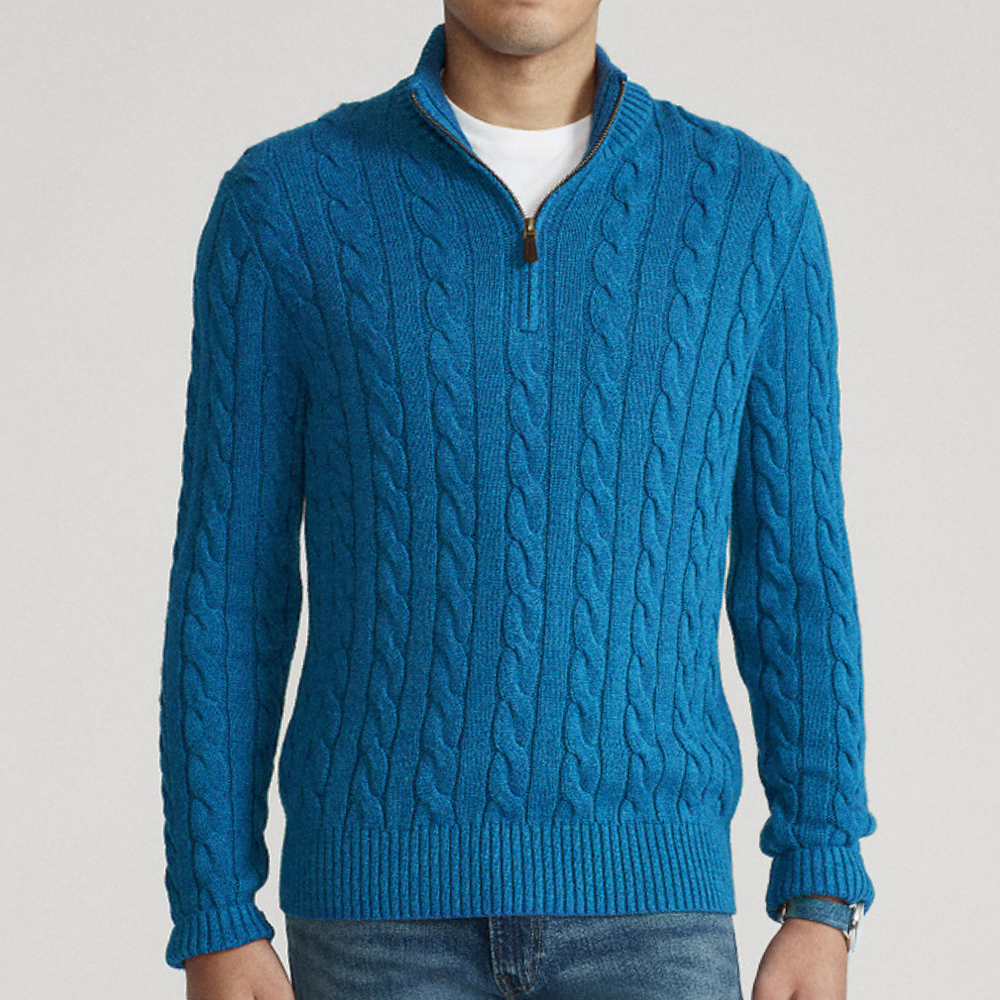 A men's cable knit sweater featuring a classic design with a zip-up collar, tailored for warmth and style, perfect for casual wear or layering in colder weather.