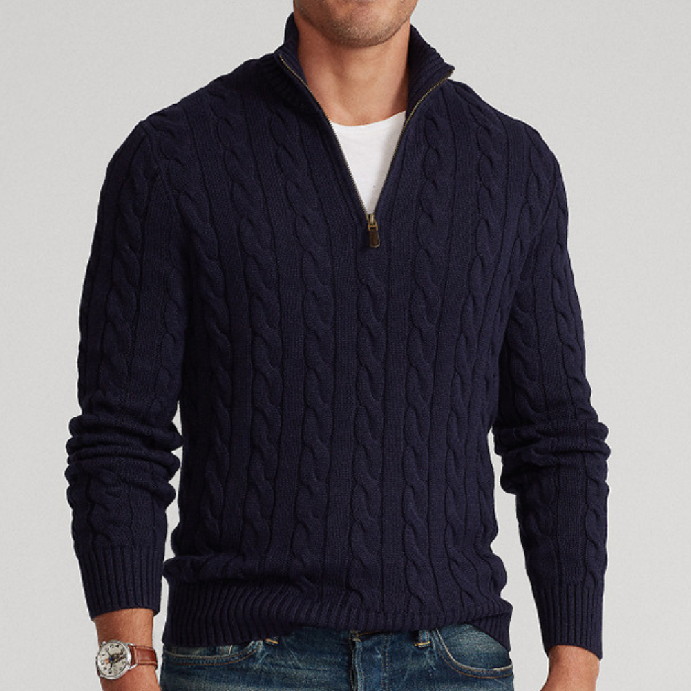 A men's cable knit sweater featuring a classic design with a zip-up collar, tailored for warmth and style, perfect for casual wear or layering in colder weather.
