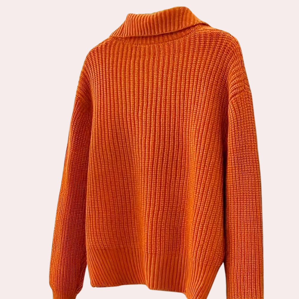 Chunky knit cardigan with oversized buttons, styled with a chic outfit for a cozy and fashionable look, perfect for layering in cooler weather.
