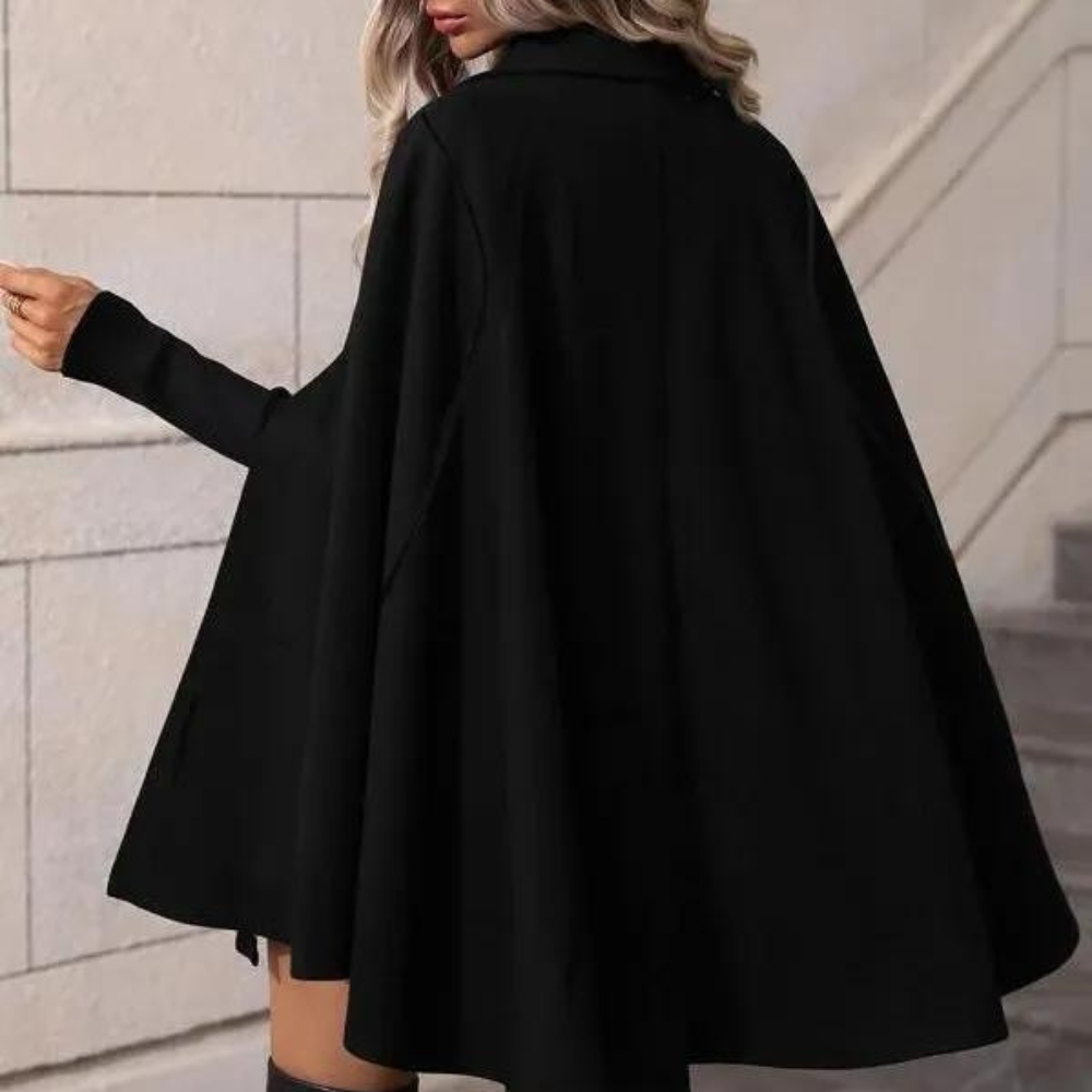 Chic women's cape coat with a sophisticated design featuring double-breasted buttons and a flowing silhouette, perfect for formal or casual occasions.