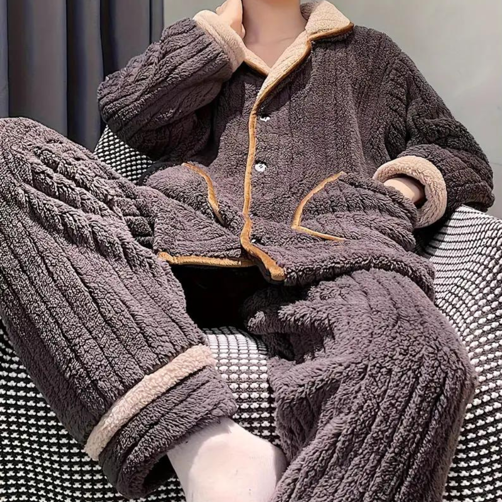 Cozy men's loungewear set featuring a button-up top with pockets and matching relaxed-fit pants, perfect for comfort and casual homewear.