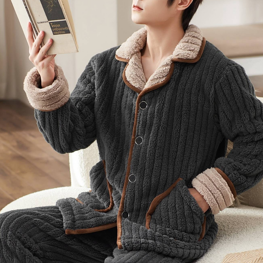 Cozy men's loungewear set featuring a button-up top with pockets and matching relaxed-fit pants, perfect for comfort and casual homewear.
