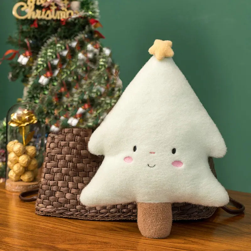 Festive plush toy set featuring a Christmas tree, gingerbread house, wreath, and gingerbread figure, displayed in a cozy holiday-themed setting with wrapped gifts and decorations.