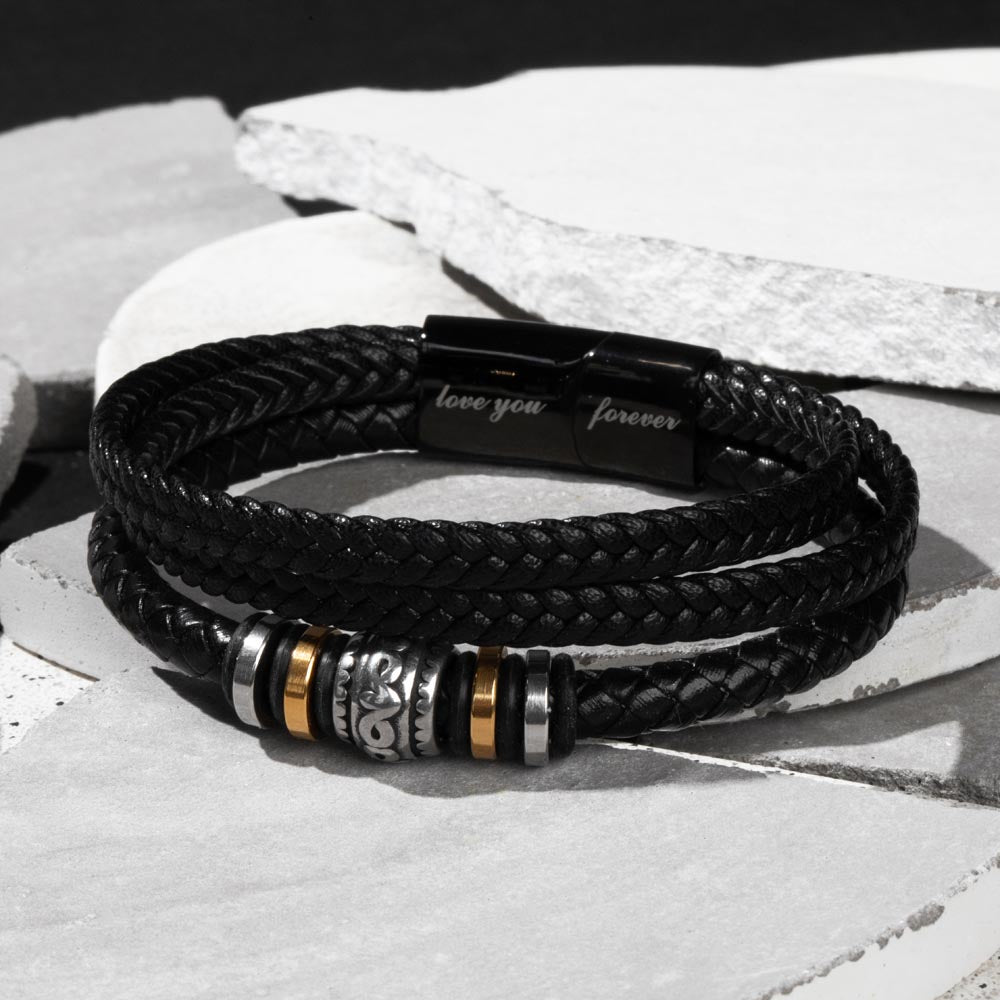 Men's multi-strand bracelet featuring a layered design with intricate details, worn on the wrist to showcase its modern and stylish appearance.
