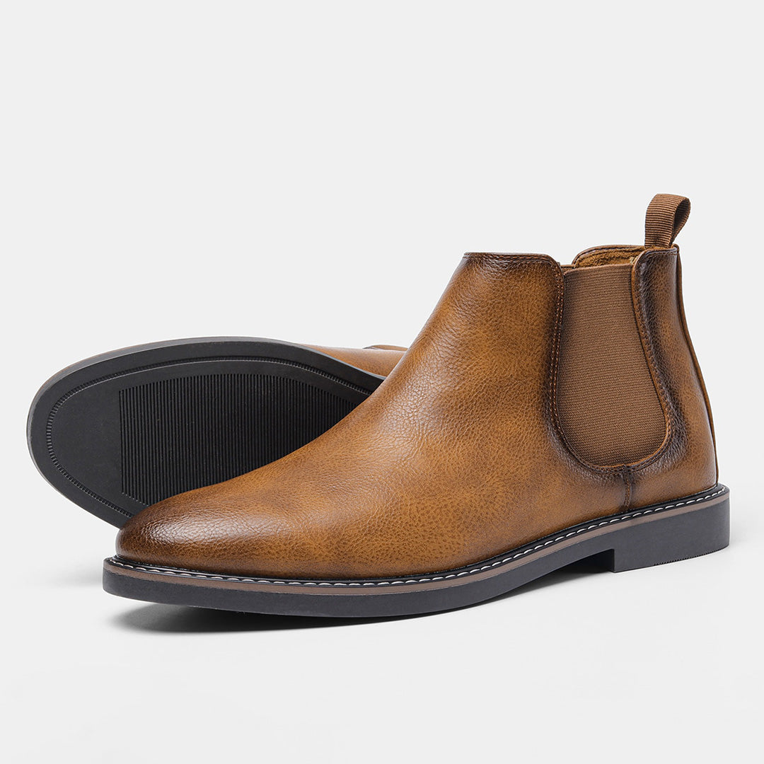 Men's ankle boots with a sleek design and durable construction, featuring a pull-tab and sturdy sole, perfect for versatile everyday wear.