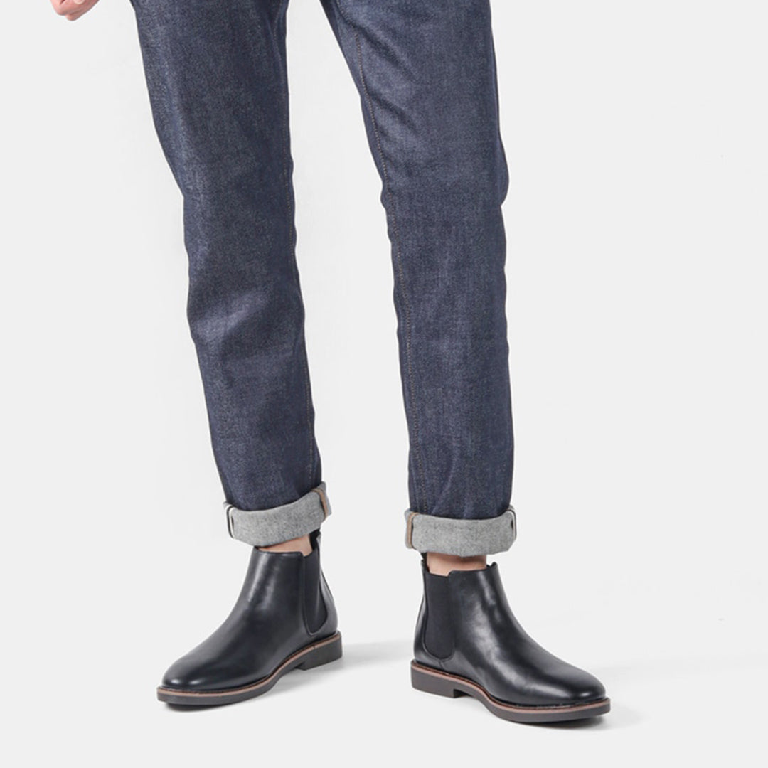 Men's ankle boots with a sleek design and durable construction, featuring a pull-tab and sturdy sole, perfect for versatile everyday wear.