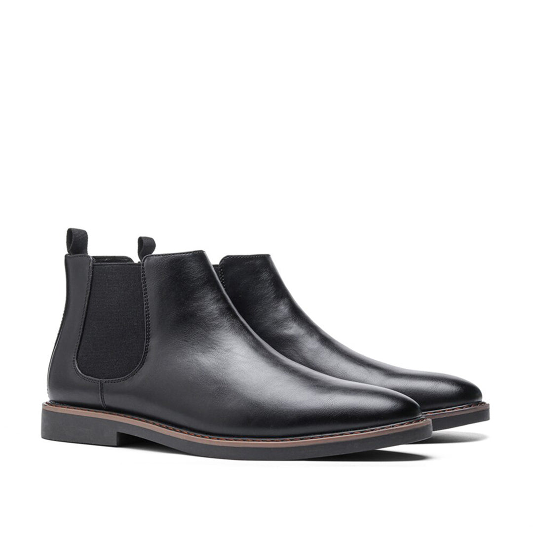 Men's ankle boots with a sleek design and durable construction, featuring a pull-tab and sturdy sole, perfect for versatile everyday wear.