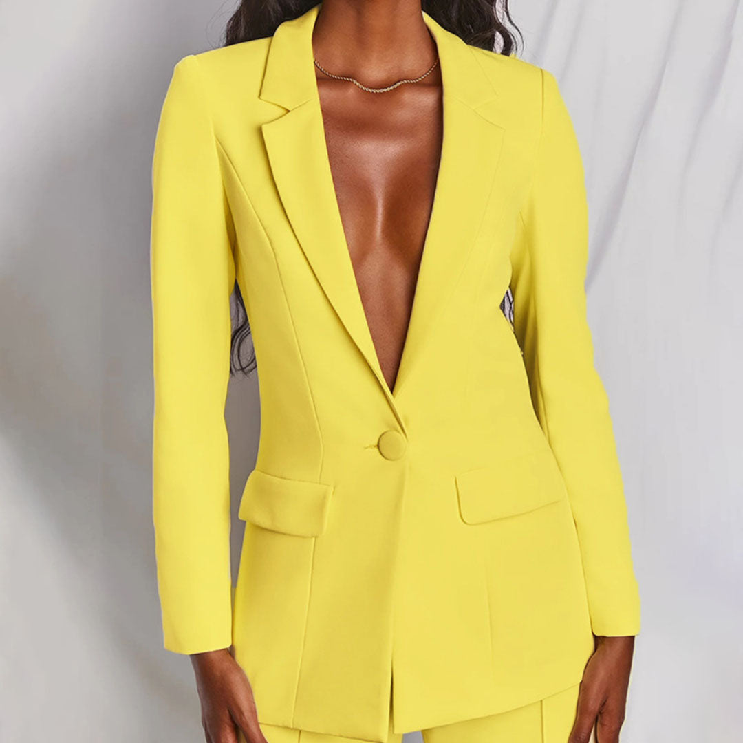 Elegant women's tailored suit set featuring a blazer and matching trousers, designed for a formal and sophisticated look.