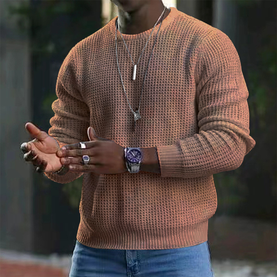A stylish men's textured sweater featuring a modern design, paired with casual jeans and accessories. Perfect for a sleek and comfortable look suitable for both casual outings and smart occasions.