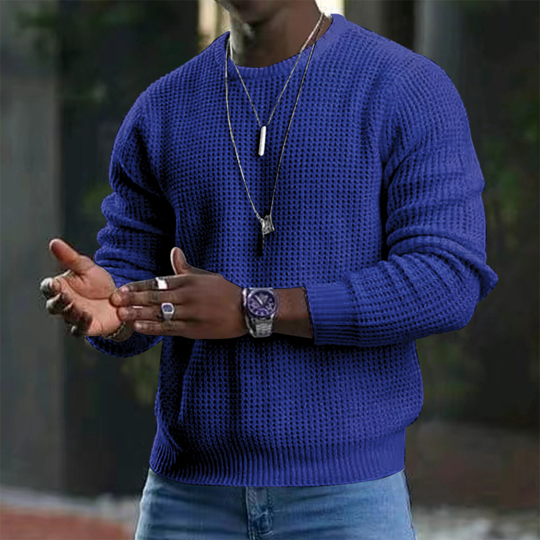 A stylish men's textured sweater featuring a modern design, paired with casual jeans and accessories. Perfect for a sleek and comfortable look suitable for both casual outings and smart occasions.