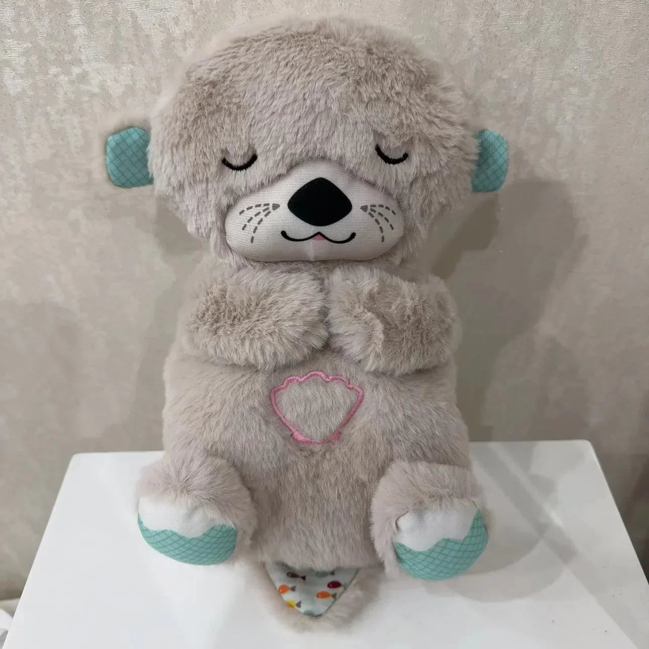 Adorable plush koala toy holding a festive pumpkin with a glowing face, designed to add charm and warmth to any holiday or celebration setting.