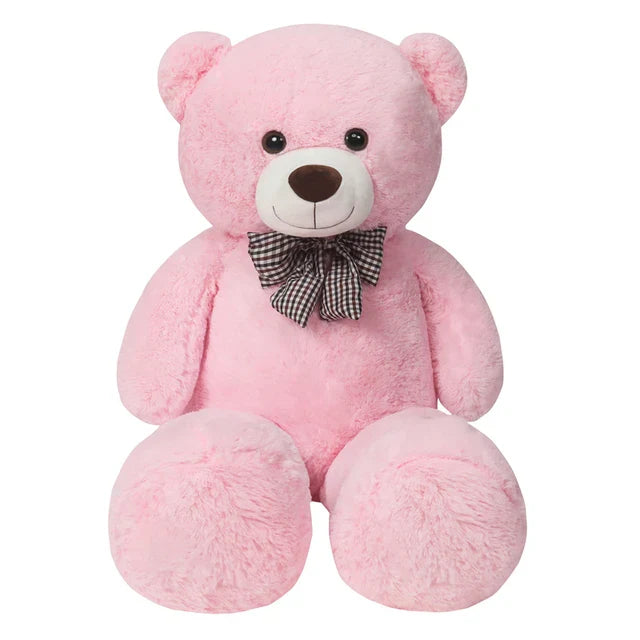 A giant plush bear with a huggable design, featuring soft fabric and an adorable bow, perfect for cuddles, decoration, or as a thoughtful gift for all ages.