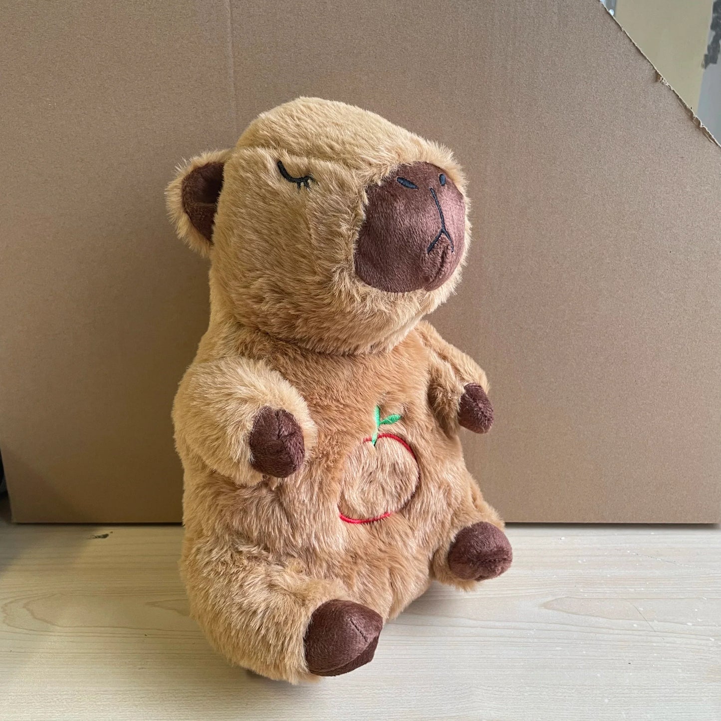 Adorable plush koala toy holding a festive pumpkin with a glowing face, designed to add charm and warmth to any holiday or celebration setting.