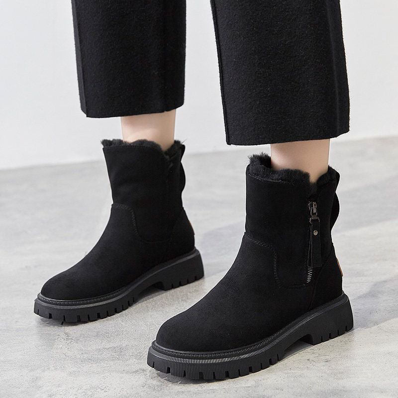 A pair of women's cozy winter boots featuring a soft lining, durable design, and a convenient side zipper for easy wear, perfect for keeping feet warm and stylish during the colder months.