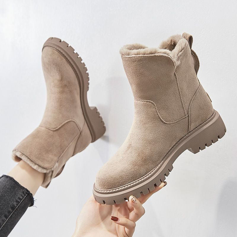 A pair of women's cozy winter boots featuring a soft lining, durable design, and a convenient side zipper for easy wear, perfect for keeping feet warm and stylish during the colder months.