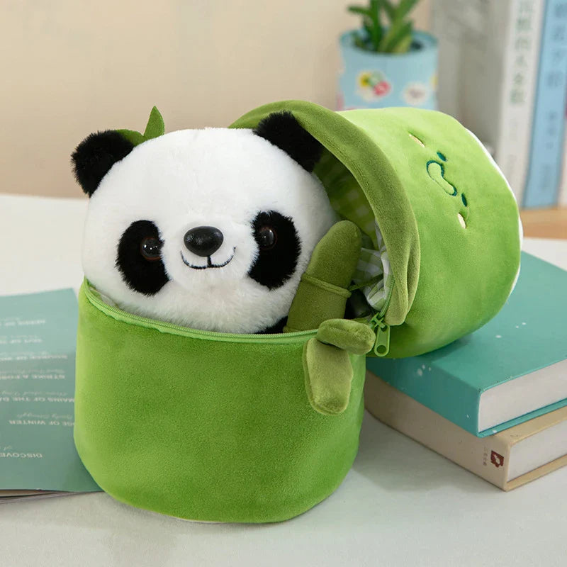 Plush panda toy set featuring a cute panda holding a bamboo and an adorable smiling roll-shaped plush companion, displayed on a table with books in the background.