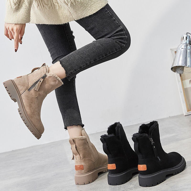 A pair of women's cozy winter boots featuring a soft lining, durable design, and a convenient side zipper for easy wear, perfect for keeping feet warm and stylish during the colder months.