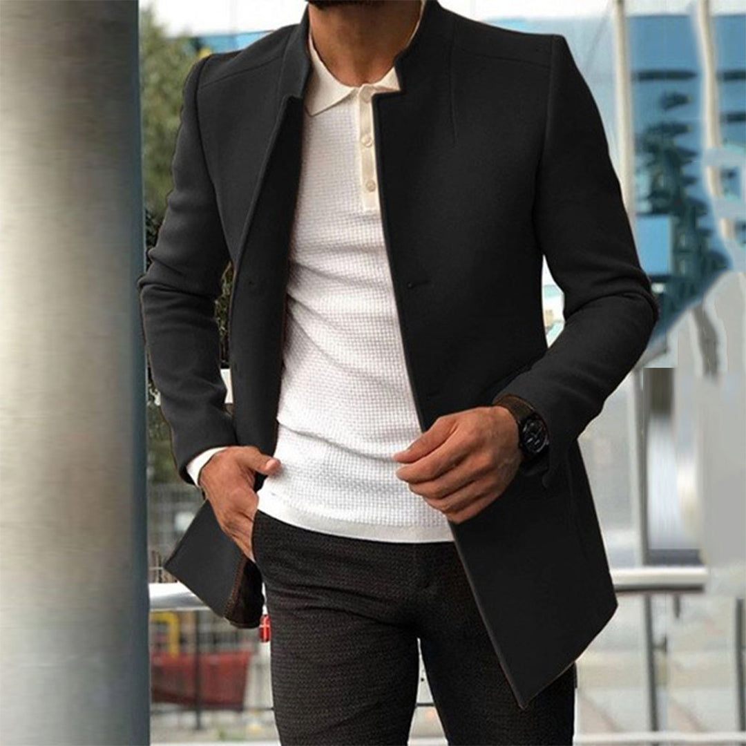 Men's tailored coat with a sleek and sophisticated design, styled over a casual shirt and trousers, perfect for formal or smart-casual occasions.