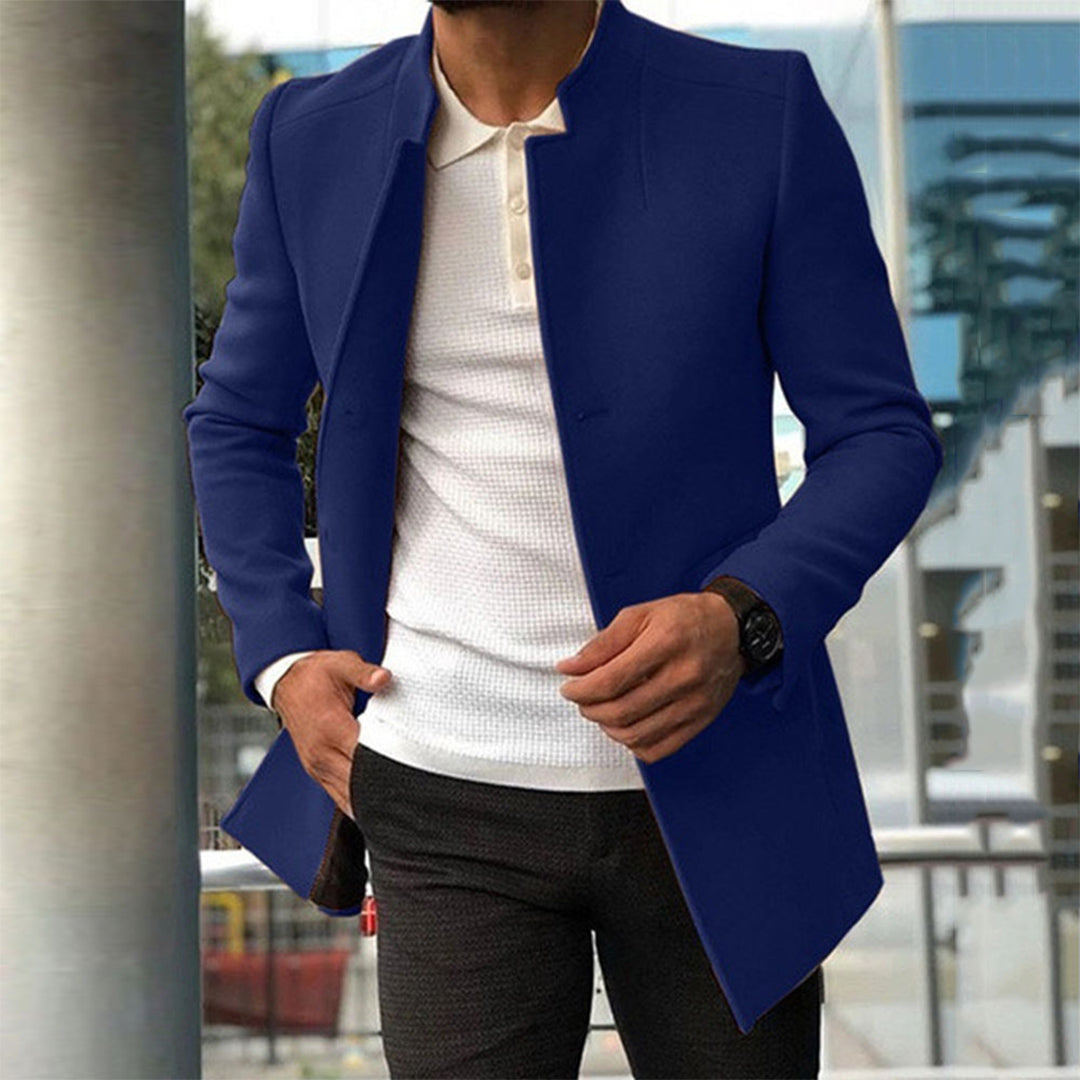 Men's tailored coat with a sleek and sophisticated design, styled over a casual shirt and trousers, perfect for formal or smart-casual occasions.