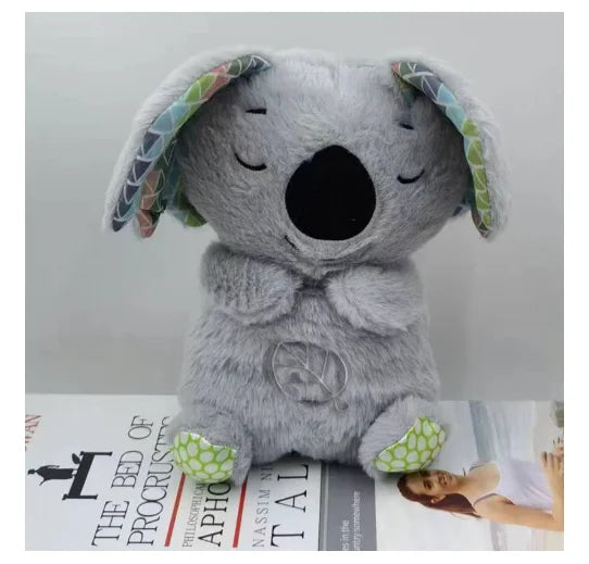 Adorable plush koala toy holding a festive pumpkin with a glowing face, designed to add charm and warmth to any holiday or celebration setting.