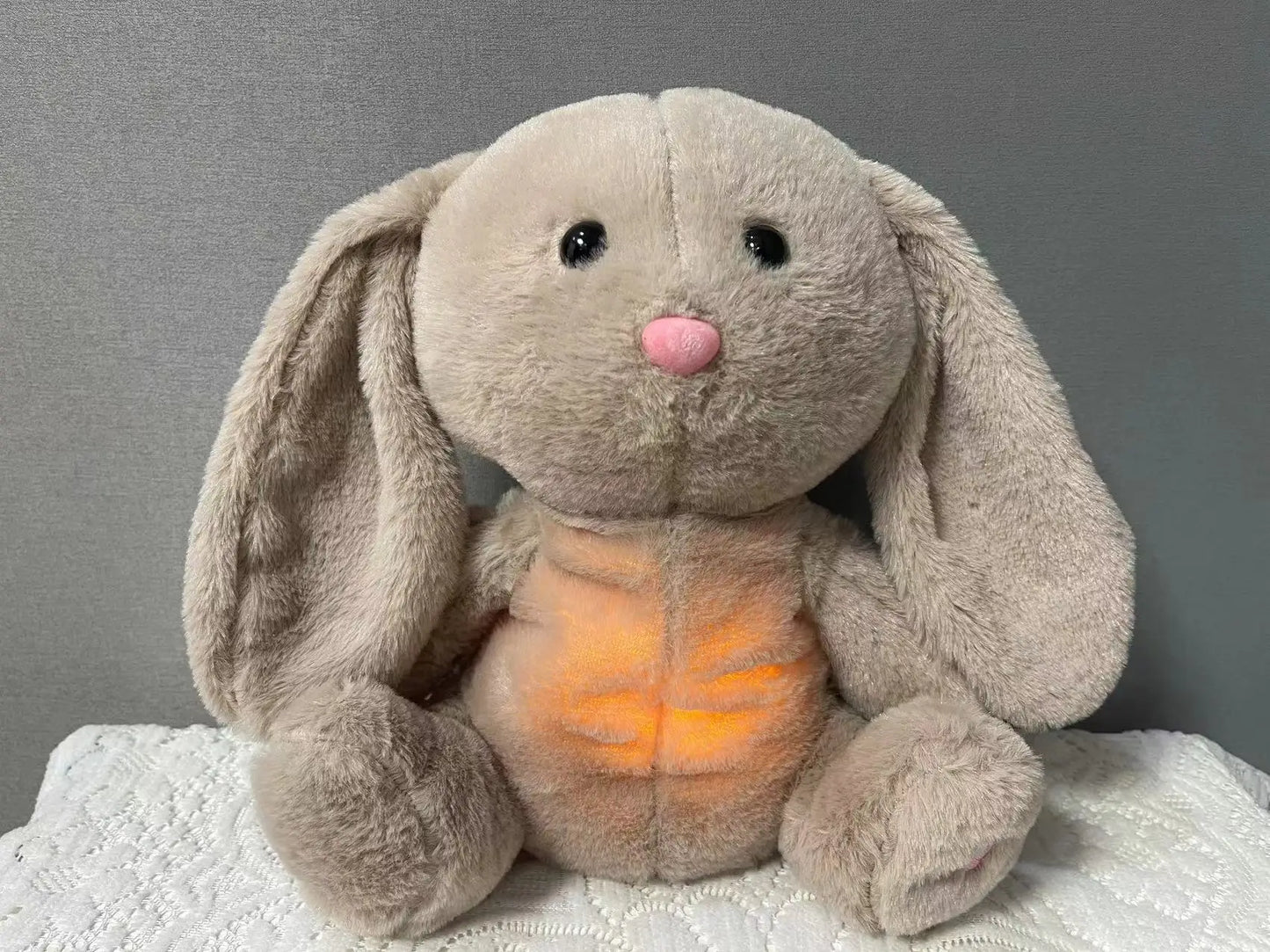 Adorable plush koala toy holding a festive pumpkin with a glowing face, designed to add charm and warmth to any holiday or celebration setting.