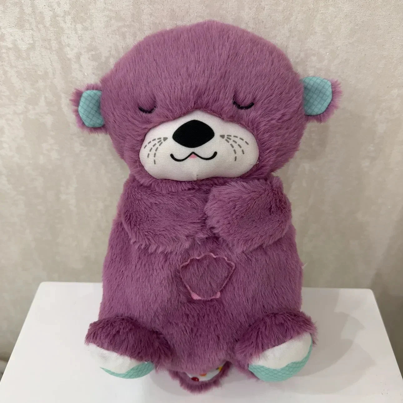 Adorable plush koala toy holding a festive pumpkin with a glowing face, designed to add charm and warmth to any holiday or celebration setting.