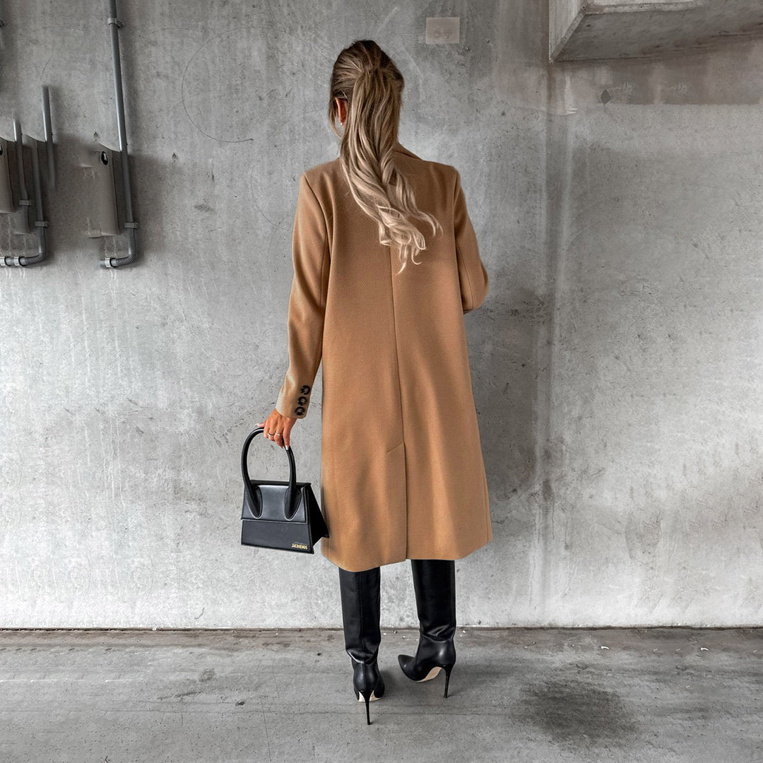 Women's classic long coat featuring a tailored fit, double-breasted buttons, and a chic design, perfect for casual and formal occasions.