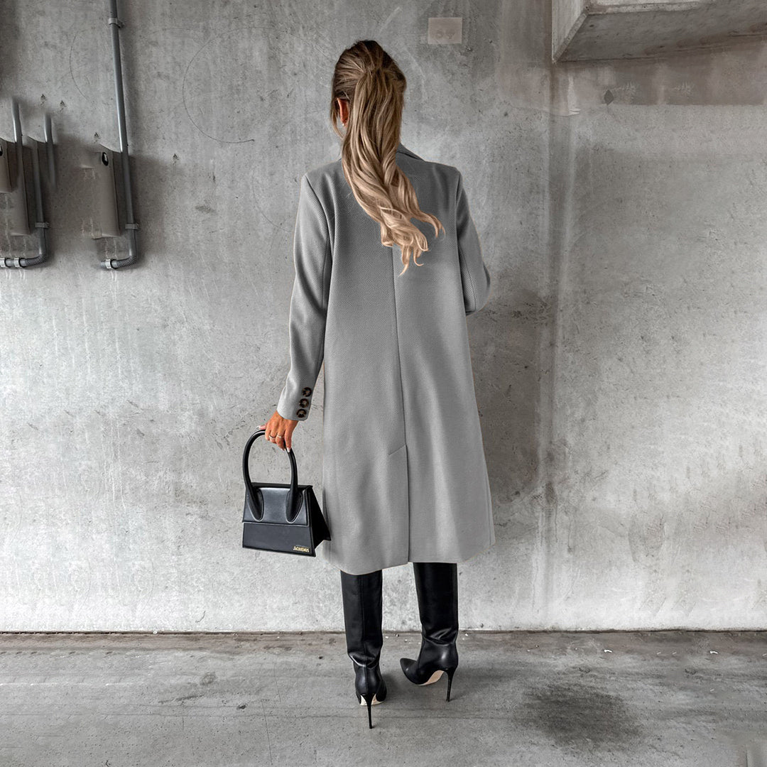 Women's classic long coat featuring a tailored fit, double-breasted buttons, and a chic design, perfect for casual and formal occasions.