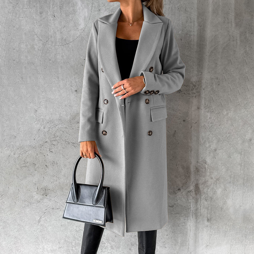 Women's classic long coat featuring a tailored fit, double-breasted buttons, and a chic design, perfect for casual and formal occasions.