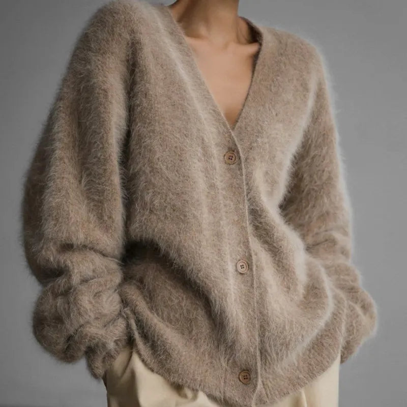 Women's soft knit cardigan with button-down front, featuring a cozy and elegant design, perfect for layering or standalone wear.