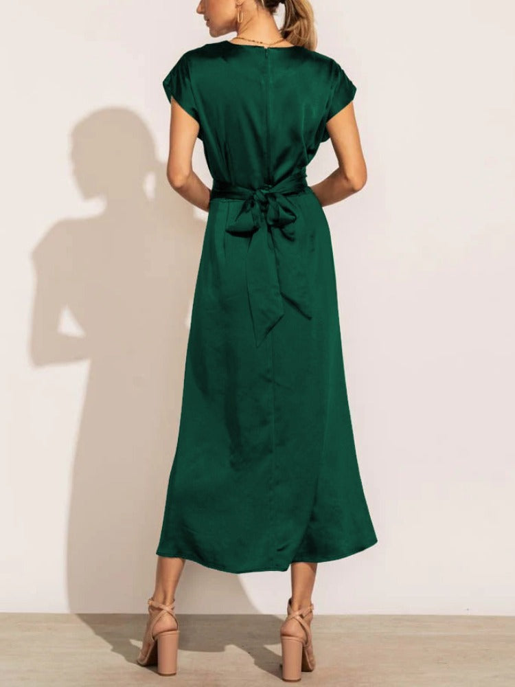 A graceful women's satin wrap dress with an elegant flow, featuring a flattering silhouette and luxurious fabric, perfect for formal occasions or special events.
