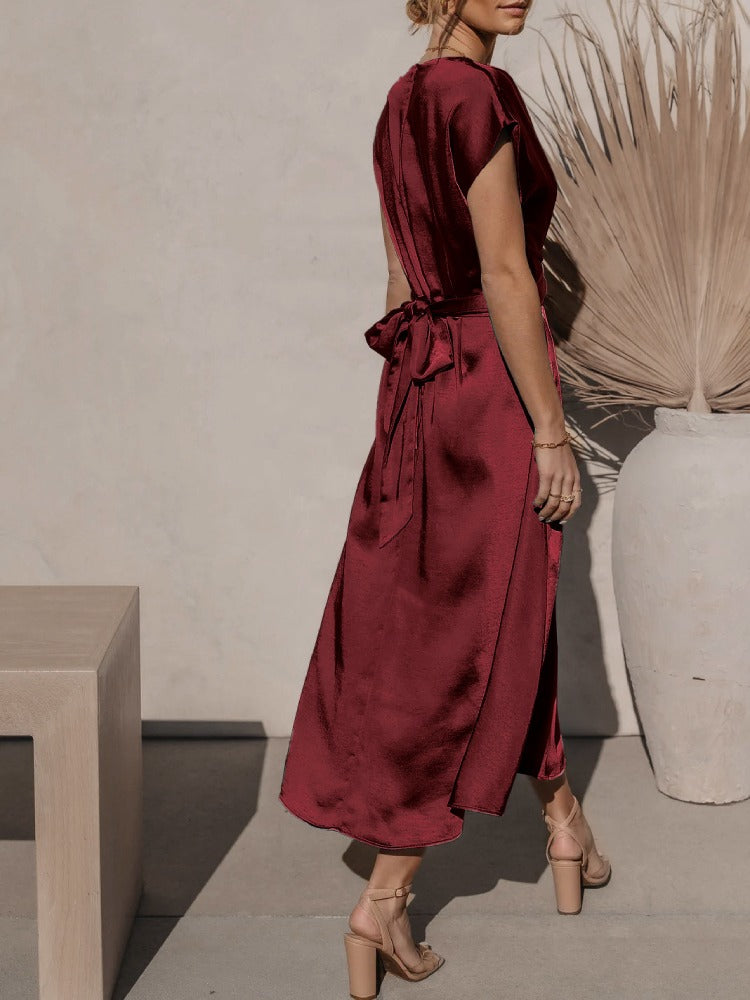 A graceful women's satin wrap dress with an elegant flow, featuring a flattering silhouette and luxurious fabric, perfect for formal occasions or special events.