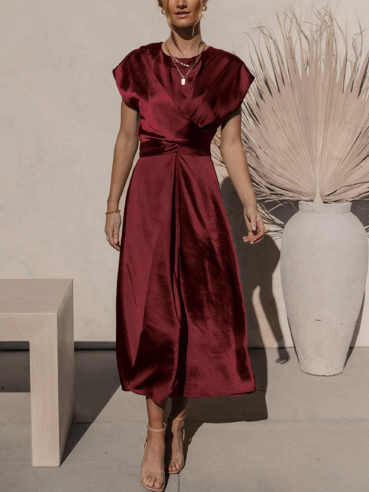 A graceful women's satin wrap dress with an elegant flow, featuring a flattering silhouette and luxurious fabric, perfect for formal occasions or special events.