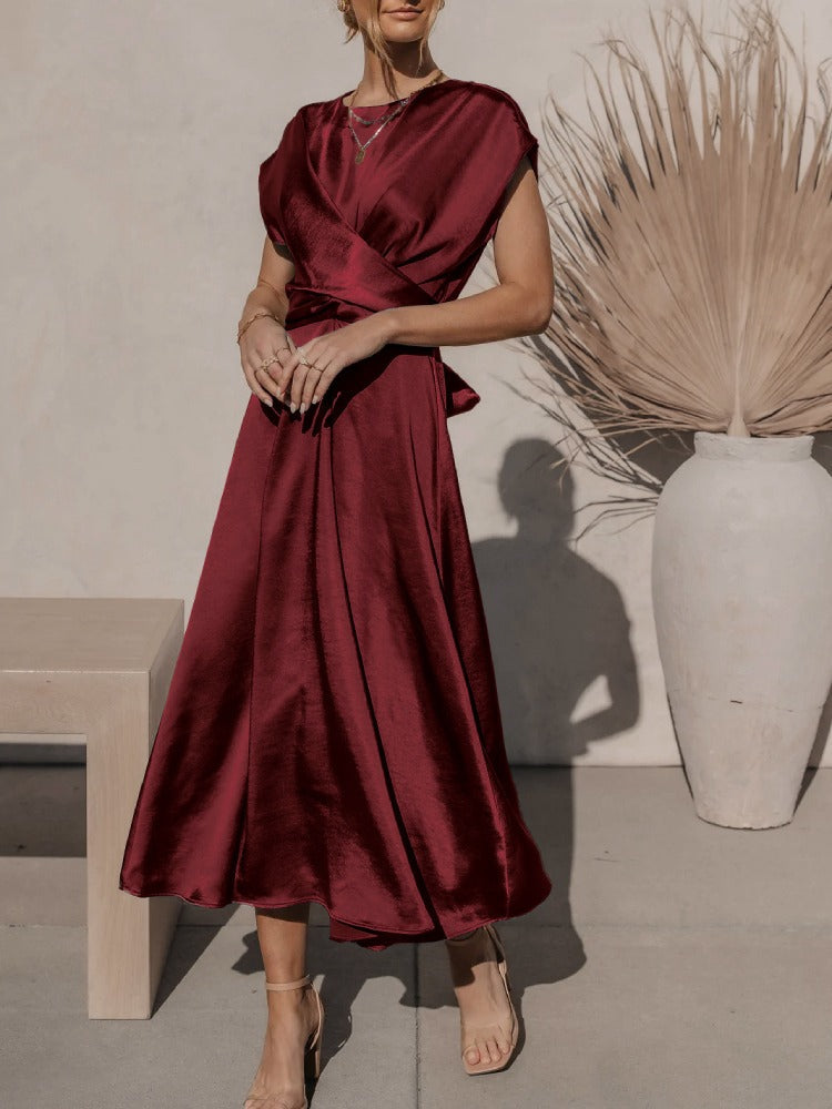 A graceful women's satin wrap dress with an elegant flow, featuring a flattering silhouette and luxurious fabric, perfect for formal occasions or special events.