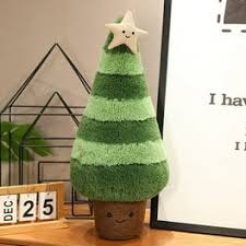 A plush tree decoration with a star on top, designed for festive home decor, placed on a wooden table near a minimalist calendar and decorative frame.