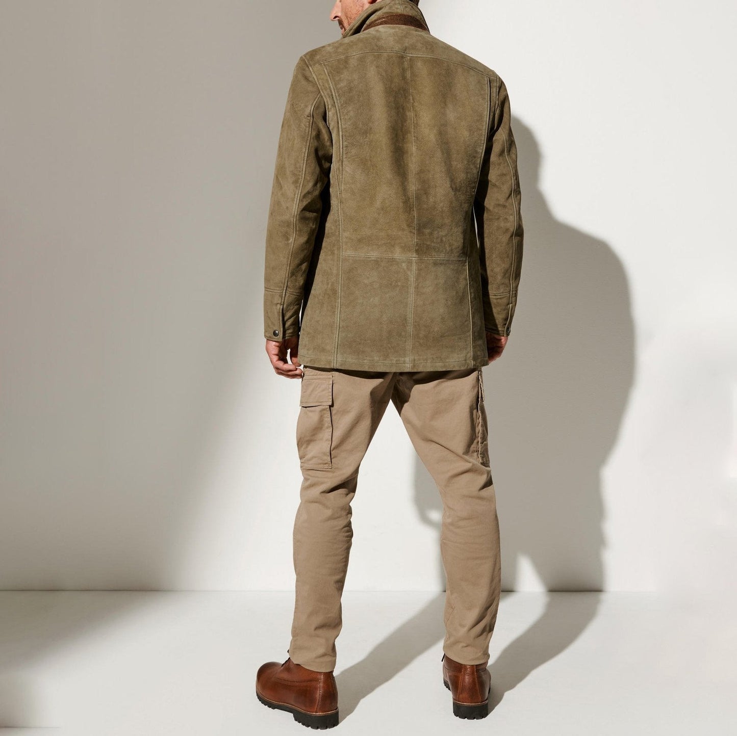 A men's suede blazer featuring a refined design with tailored details, perfect for formal events or smart-casual outings, exuding timeless elegance and sophistication.