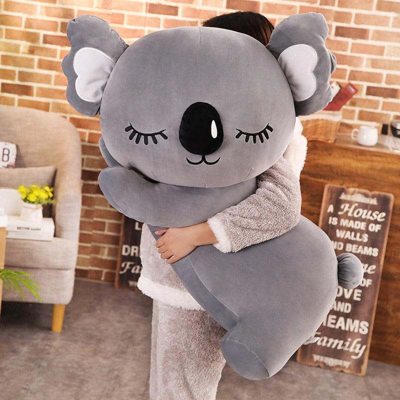 An oversized plush koala toy with a soft and huggable design, featuring a charming face and cuddly texture, perfect for snuggles, room decor, or as a thoughtful gift for all ages.