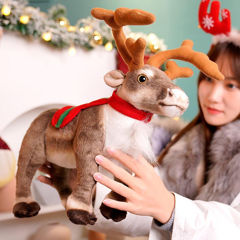 Festive plush reindeer set featuring two reindeer stacked playfully, displayed in a holiday-themed setting with decorations and gifts.